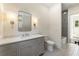 Modern bathroom featuring a gray vanity, marble countertop, and tiled floors at 779 Hicks Rd, Canton, GA 30115