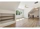 Bright bonus room with custom built-ins, ceiling fan and hardwood floors at 779 Hicks Rd, Canton, GA 30115