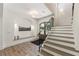 Foyer featuring hardwood floors, staircase, and mud room style built ins at 779 Hicks Rd, Canton, GA 30115