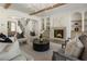 Comfortable living room with hardwood floors, fireplace, and staircase access at 779 Hicks Rd, Canton, GA 30115