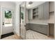 Well-organized mudroom with custom cabinets, designer tile, and access to the backyard at 779 Hicks Rd, Canton, GA 30115