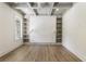 Office featuring hardwood floors, geometric coffered ceiling, and built in bookshelves at 779 Hicks Rd, Canton, GA 30115