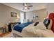 Comfortable bedroom with a ceiling fan, bright window, a desk and stylish accents at 1600 Brisbane Drive, Dacula, GA 30019