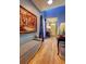 Inviting entryway with bench seating, an art piece, and a view into the home at 1600 Brisbane Drive, Dacula, GA 30019