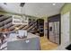 Modern kitchen featuring stainless steel appliances, sleek cabinetry, a tile backsplash, and an island with pendant lighting at 1600 Brisbane Drive, Dacula, GA 30019