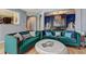 Elegant living room showcasing designer sofas, light wood floors, a patterned screen, and a marble-topped coffee table at 1600 Brisbane Drive, Dacula, GA 30019