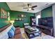 Comfortable living room with a ceiling fan, large windows, and stylish decor at 1600 Brisbane Drive, Dacula, GA 30019