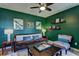 Comfortable living room with a ceiling fan, large windows, and stylish decor at 1600 Brisbane Drive, Dacula, GA 30019
