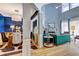 Open living space featuring a dining area, living room, modern furnishings, and a cozy fireplace under natural light at 1600 Brisbane Drive, Dacula, GA 30019
