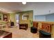 Cozy sitting area features plush seating, stylish decor, and ample natural light, perfect for relaxation and entertaining at 1600 Brisbane Drive, Dacula, GA 30019