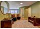 Cozy sitting area features plush seating, stylish decor, and ample natural light, perfect for relaxation and entertaining at 1600 Brisbane Drive, Dacula, GA 30019