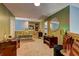 Cozy sitting area features plush seating, stylish decor, and ample natural light, perfect for relaxation and entertaining at 1600 Brisbane Drive, Dacula, GA 30019