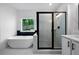 Modern bathroom featuring a glass enclosed shower, soaking tub, and elegant black and white design at 270 Harmony Woods Dr, Dallas, GA 30157