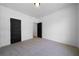 Spacious bedroom featuring plush carpet, recessed lighting, and modern doors at 270 Harmony Woods Dr, Dallas, GA 30157