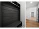 Entryway featuring a modern black mudroom organizer with bench seating and storage at 270 Harmony Woods Dr, Dallas, GA 30157