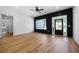 Inviting living room features dark wood accent wall, large windows, and hardwood floors at 270 Harmony Woods Dr, Dallas, GA 30157