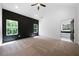 Spacious main bedroom with board and batten accent wall, plush carpet, and ample natural light at 270 Harmony Woods Dr, Dallas, GA 30157