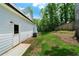 Side yard with freshly installed sod and a white exterior door, ready for outdoor enjoyment at 270 Harmony Woods Dr, Dallas, GA 30157