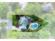 Aerial view of the property highlighting the pool, patio, landscaping, and outlined property lines at 2882 Clary Hill Ne Dr, Roswell, GA 30075