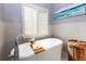 Bright bathroom with freestanding tub, modern fixtures, and a serene atmosphere at 2882 Clary Hill Ne Dr, Roswell, GA 30075