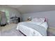 Bright bedroom featuring a comfortable bed, and a vanity area with a mirror and natural light from a window at 2882 Clary Hill Ne Dr, Roswell, GA 30075