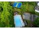 Aerial view of community pool, tennis courts, and amenities surrounded by lush greenery at 2882 Clary Hill Ne Dr, Roswell, GA 30075