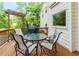 Cozy wooden deck featuring a grill, dining area, and a view of the surrounding greenery at 2882 Clary Hill Ne Dr, Roswell, GA 30075
