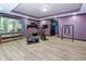 Home gym featuring fitness equipment, wood floors, recessed lighting, and a bench by the window at 2882 Clary Hill Ne Dr, Roswell, GA 30075