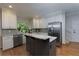 Bright kitchen boasts stainless steel appliances, granite countertops, and a functional kitchen island at 2882 Clary Hill Ne Dr, Roswell, GA 30075