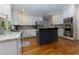 Modern kitchen with white cabinets, stainless steel appliances, and granite countertops at 2882 Clary Hill Ne Dr, Roswell, GA 30075