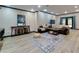 Living room featuring hardwood floors, comfortable couches, decor, and double doors that lead to the backyard at 2882 Clary Hill Ne Dr, Roswell, GA 30075