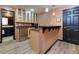 Wet bar featuring modern cabinets, granite countertops, a mini fridge, and a sink at 2882 Clary Hill Ne Dr, Roswell, GA 30075