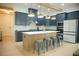Modern kitchen featuring a center island, stainless steel appliances, stylish lighting, and custom cabinets at 423 Ward Ln, Woodstock, GA 30188