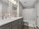 Bathroom with a double vanity, a shower and tub combo, and modern lighting at 4406 Idlewood Ln, Tucker, GA 30084