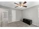 Bedroom with a ceiling fan, carpeting, and doorways to other rooms at 4406 Idlewood Ln, Tucker, GA 30084