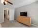 Bedroom with a ceiling fan, carpeting, a dresser, and a closet at 4406 Idlewood Ln, Tucker, GA 30084