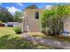 Exterior view of home with siding, a small yard, and walkway at 4406 Idlewood Ln, Tucker, GA 30084