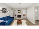 Cozy living room featuring a fireplace, ample natural light, and stylish decor at 4406 Idlewood Ln, Tucker, GA 30084
