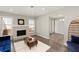 Bright and airy living room with hardwood floors, fireplace, modern furnishings and a cozy seating area at 4406 Idlewood Ln, Tucker, GA 30084