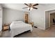 Bedroom featuring a ceiling fan, a window, and two doorways at 4406 Idlewood Ln, Tucker, GA 30084