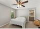 Main bedroom with a ceiling fan, a window, and access to the bathroom at 4406 Idlewood Ln, Tucker, GA 30084