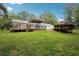 Sprawling backyard with various outdoor living spaces, including two decks and a gazebo at 4825 Rollins Dr, Powder Springs, GA 30127