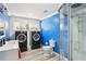 Bright bathroom boasts modern shower, updated flooring, and front load laundry at 4825 Rollins Dr, Powder Springs, GA 30127
