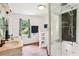 Bathroom with double vanity, walk-in shower, jetted tub, and tiled floors at 4825 Rollins Dr, Powder Springs, GA 30127
