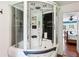 Main bathroom featuring a modern walk-in shower with jets next to the bedroom at 4825 Rollins Dr, Powder Springs, GA 30127