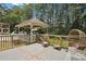 An outdoor deck featuring a gazebo, egg chairs, and lots of space to enjoy at 4825 Rollins Dr, Powder Springs, GA 30127