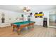 Spacious game room with pool table, arcade game and multiple seating options at 4825 Rollins Dr, Powder Springs, GA 30127