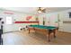 Spacious game room with pool table and sports-themed decor at 4825 Rollins Dr, Powder Springs, GA 30127