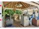 Cozy outdoor gazebo with a ceiling fan, grill, hammocks, and counterspace at 4825 Rollins Dr, Powder Springs, GA 30127