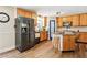 Updated kitchen with stainless steel appliances and center island seating at 4825 Rollins Dr, Powder Springs, GA 30127